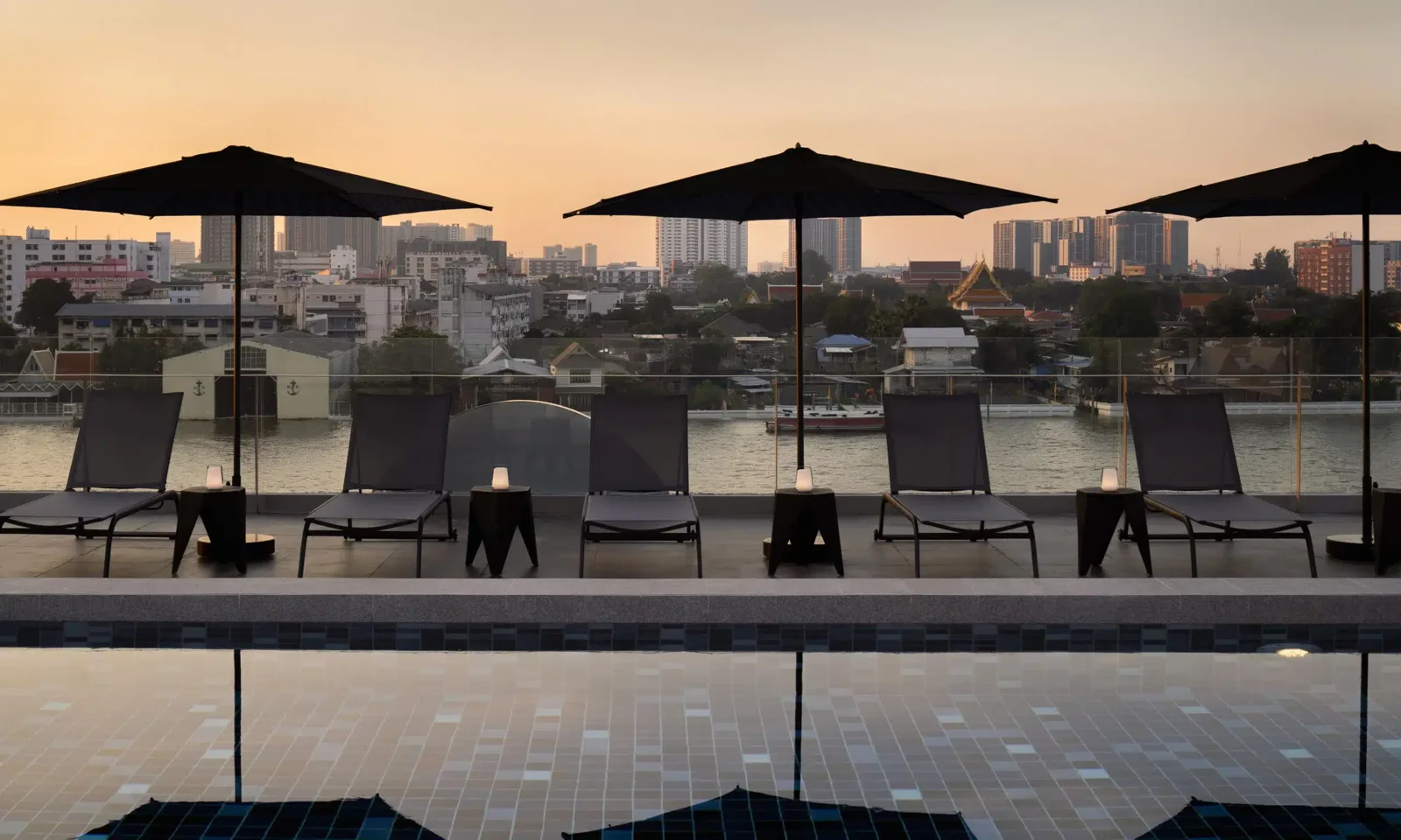 Rooftop pool terrace at sunset